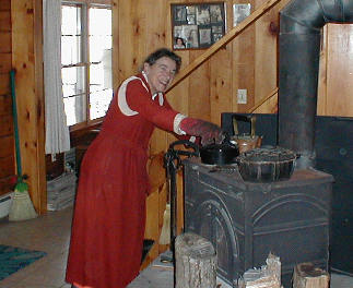 Mom tends the wood stove