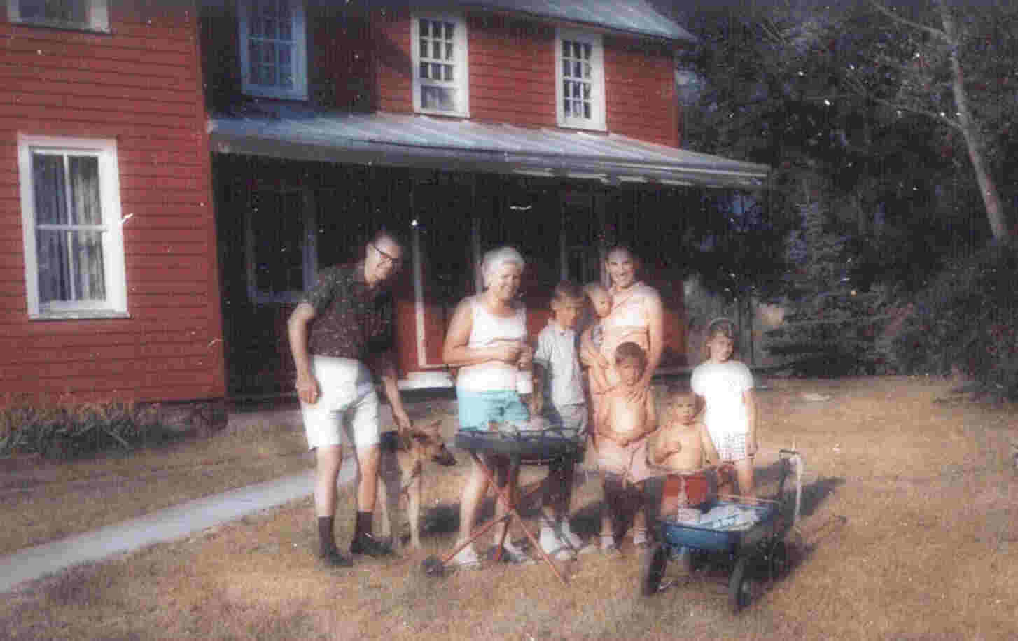 family and czarina in front of house